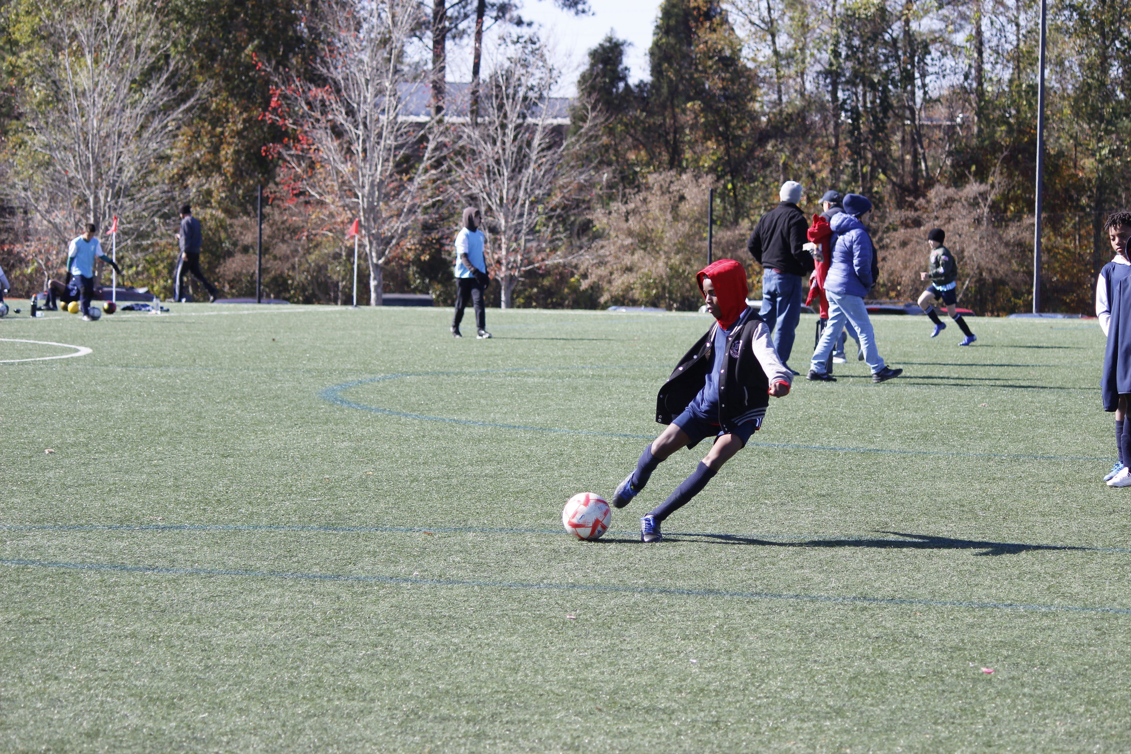 Boy practicing soccer scoring